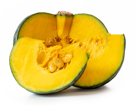 Green Japanese pumpkin fruit in half and two quarters or slices in stack isolated on white background with clipping path