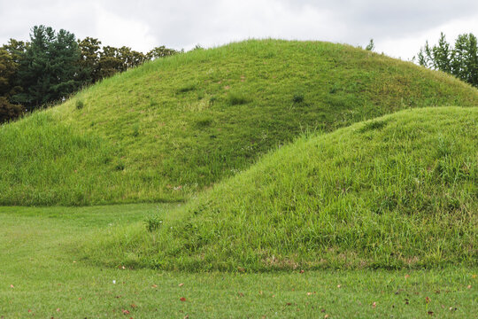 Daereungwon Tomb Complex in a sunny day, Gyeongju, South Korea, tumulus royal imperial Silla dynasty tombs, mound green grassy hill, North Gyeongsang Province, Gyeongju city view, Yeongnam region