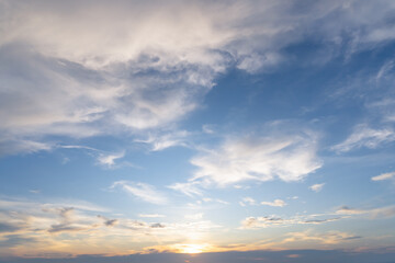 Obraz premium Beautiful morning or evening blue and orange sky with cloudy while sunsets or sunrises taken at the sea used as natural background texture