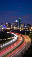 Fototapeta premium Cityscape at night with highway traffic.