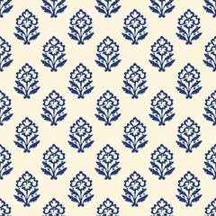 Indian block print seamless pattern with small ikat floral motifs arranged in neat grid on warm cream background traditional hand carved woodblock textile design. © opart