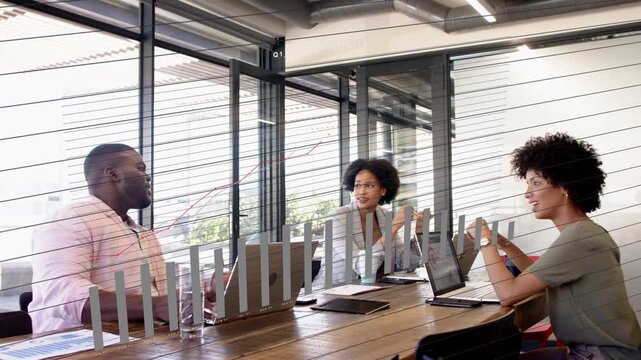 Left man speaking on laptop initiating business overlay as team pointing and studying rising chart
