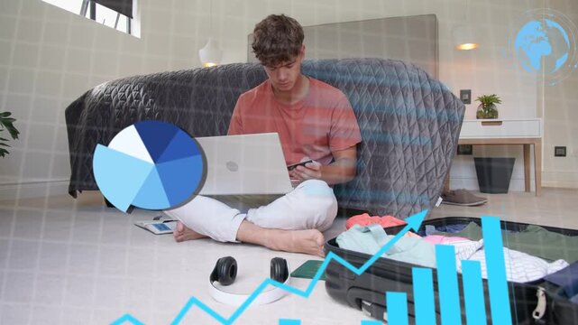 Man tapping phone and typing laptop on floor causing data charts evolving while packing suitcase