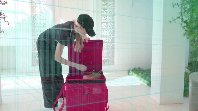 Delivery worker arriving at porch, unpacking red insulated bag, handing brown paper bag for order