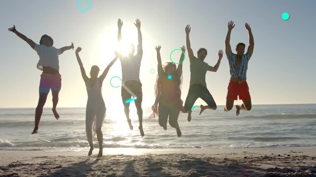 Six models squatting, launching jumps in sync on cue at backlit beach, teal shapes aiding marketing
