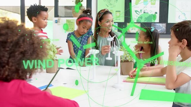 Teacher holding wind turbine model causing green AR growing over table, kids writing holding plants