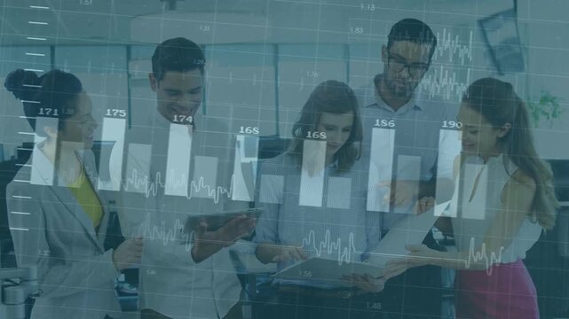 Five-person team tapping tablet, comparing folder in office, charts shifting into bar-chart overlay
