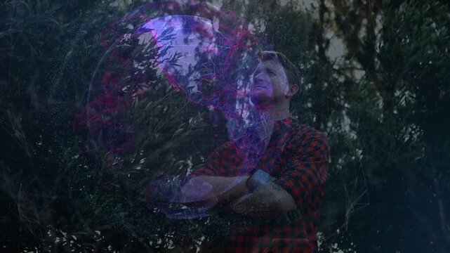 Globe appearing, man holding, gazing upward then folding arms while mapping technology networks