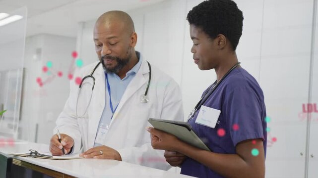 Doctor writing notes nurse station, starting color dots linking notes to tablet RN updating chart