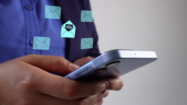 Businesswoman holding a smartphone with an animation of several closed and one open envelope icons.