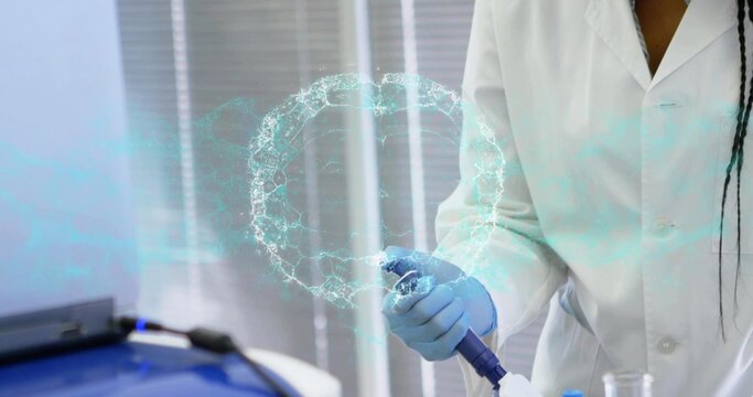 Using pipette, researcher in lab coat, nitrile gloves at bench with cyan molecular ring, copy space