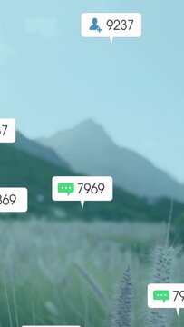 Vertical video: From frame four, notifications appearing over meadow, mountains showing engagement