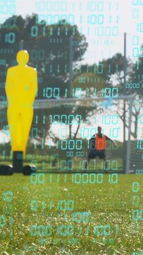 Vertical video: Player kicking ball for soccer drill, code overlay tracking path as keeper reacting