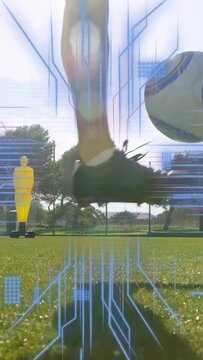 Vertical video: Male soccer player entering frame striking ball for drill, AR lines tracing dummies