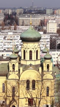 Vertical screen Closeup View Cathedral Dome And Facade Warszawa City Center, Detailed Masonry, Verdigris Copper Dome, Visible Scaffolding And Conservation Work, Texture, Ornament And Light