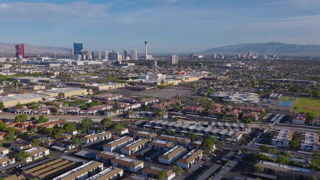 Aerial View of Las Vegas suburbs with Strip and downtown skyline and mountains