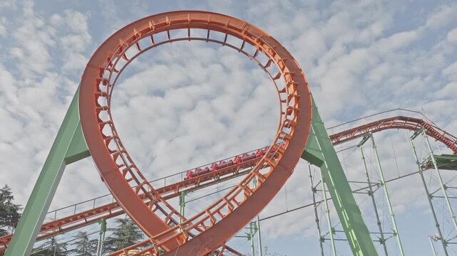 Roller Coaster Train Moving Through Vertical Loop