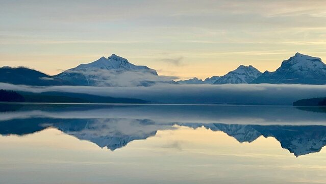 sunrise over the mountains of lake McDonald