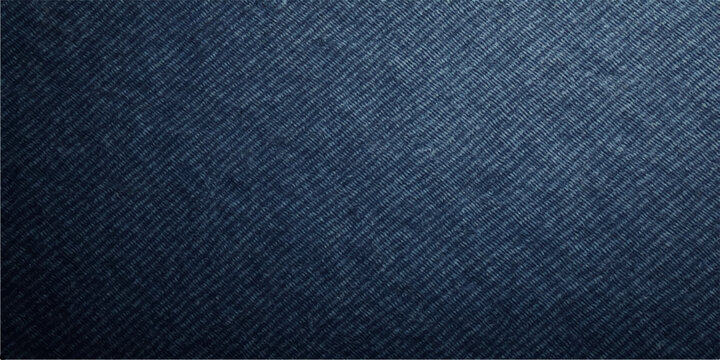 A seamless dark blue denim fabric texture provides a closeup macro view of the cotton clothing material's patterned surface for a high-fashion textile background or design backdrop