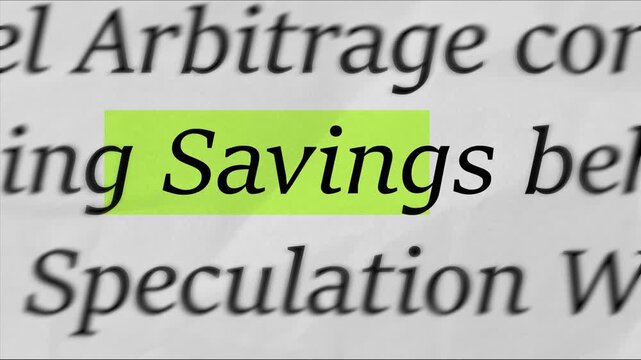 Highlighting the word Savings on printed document, macro focus text concept for money, budgeting, financial planning, frugal living and long term goals video

