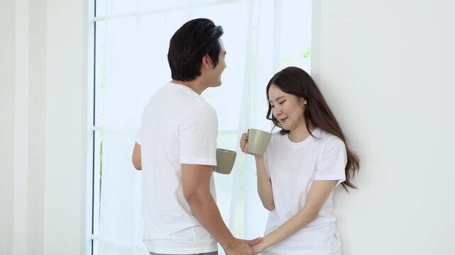 A happy relationship in a close relationship of a couple.Love expressed through romantic intimacy. A young man and woman tenderly care for each other. Asian lifestyle of embracing with sweet feelings.