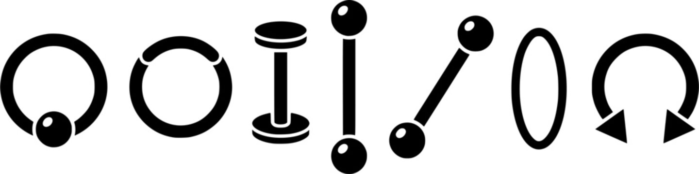 Different types of body piercing jewelry such as barbells, rings, and labrets for modern fashion accessory use
