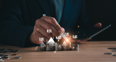 Businessman analyze glowing financial growth charts rising from coin stacks. mutual fund...