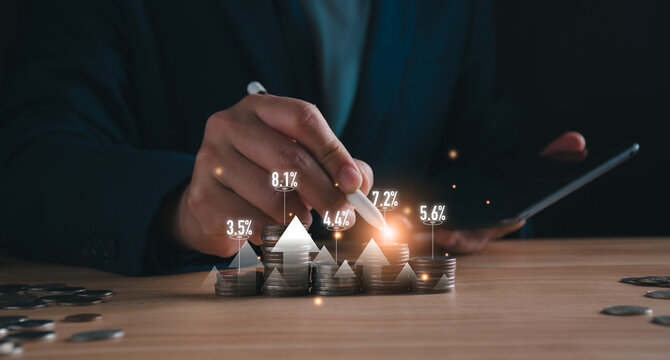 Businessman analyze glowing financial growth charts rising from coin stacks. mutual fund management, wealth accumulation, and DCA investment strategy for long-term profit and financial success.