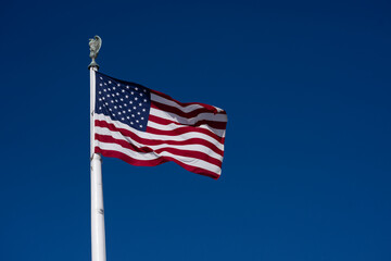 Obraz premium Flag American waving USA sky. American patriotic freedom liberty flag. USA democracy culture symbol flag. American independence heritage flag.