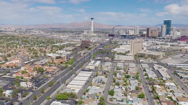Aerial rotating drone shot of Las Vegas Strip hotels and downtown