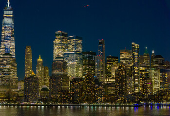 Manhattan at night. New York City panoramic skyline. NYC aerial cityscape. New York City downtown at night. New York panoramic cityscape. NYC night skyline with Manhattan. New York City aerial skyline
