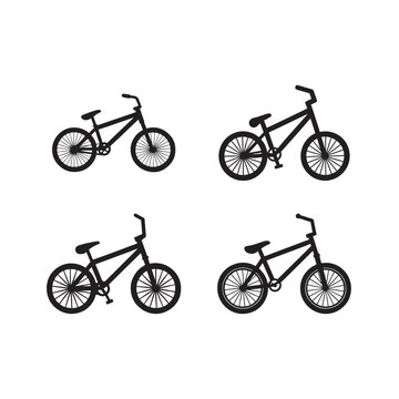 Four black bicycle silhouettes in different positions on white background  bikes facing right and left  various angles  bicycle icons