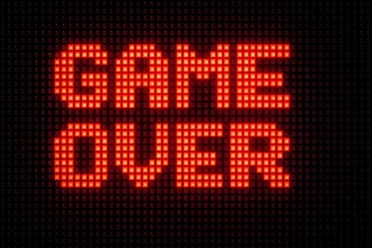 Retro pixelated glowing red led arcade screen displaying the classic game over message against a dark dot matrix background ideal for gaming and nostalgic esports themes.