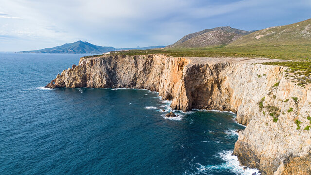 Aerial view of the limestone cliffs of Cala Domestica in Buggerru, Sardinia, Italy