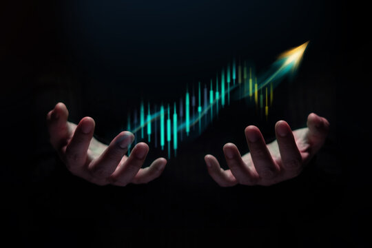 Hands holding rising graph showing business growth, financial success