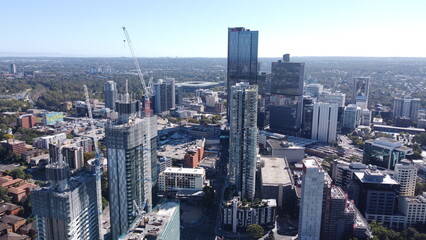 Fototapeta premium New apartment and office towers under construction driving growth & development 