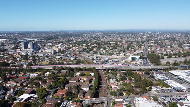 Aerial view of suburbs commercial district and train station