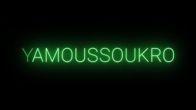 Flickering neon green glowing yamoussoukro sign animated on black background