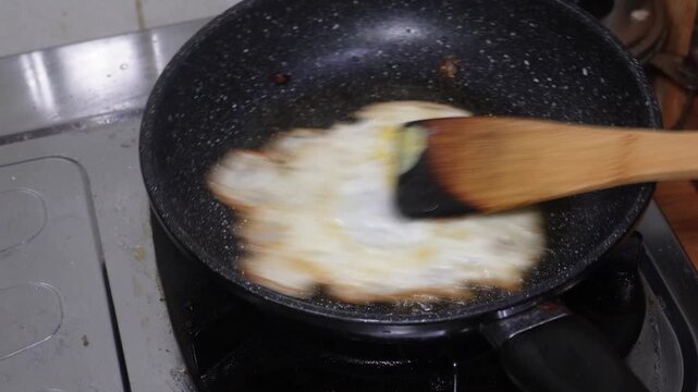 Cooking Omelet in Black Pan Close Up Video
