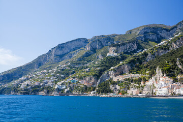 Fototapeta premium Amalfi Coast waterfront town with Monte Cerreto mountain backdrop, Italy