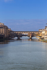 Obraz premium Famous beautiful Ponte Vecchio bridge landmark on the Arno river in the majestic city of Florence, Italy