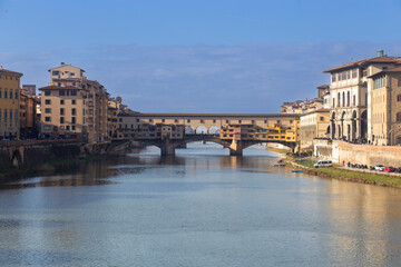 Fototapeta premium Famous beautiful Ponte Vecchio bridge landmark on the Arno river in the majestic city of Florence, Italy