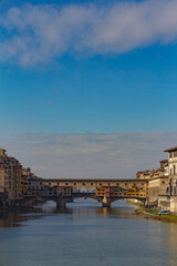 Fototapeta premium Famous beautiful Ponte Vecchio bridge landmark on the Arno river in the majestic city of Florence, Italy