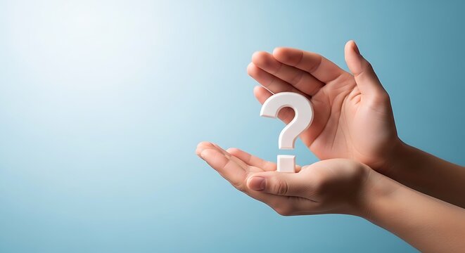 Hand holding question mark icon over blue background for ideas and decisions symbol
