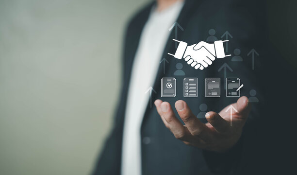 Business professional presenting digital partnership and contract management interface with handshake icon, representing business collaboration, agreement, client acquisition, and strategic growth.
