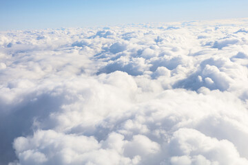 Naklejka premium Fluffy white clouds seen from above.