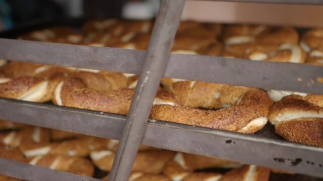 Fresh turkish simits being baked in a busy kitchen