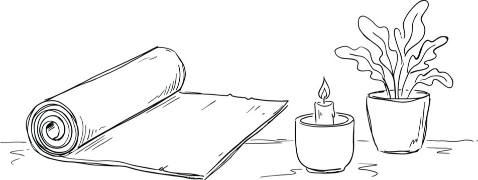 Rolled yoga mat with potted plant and burning candle on white surface.