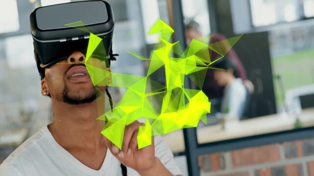 Man wearing VR headset raising finger, activating neon polygons expanding past headset, testing VR