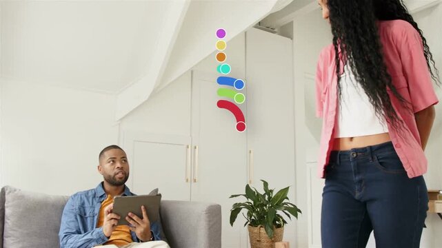 Man tapping tablet on sofa as overlays appearing between them, woman offering white card for tech